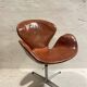 First edition Arne Jacobsen Swan chair, original patinated leather, 1950s