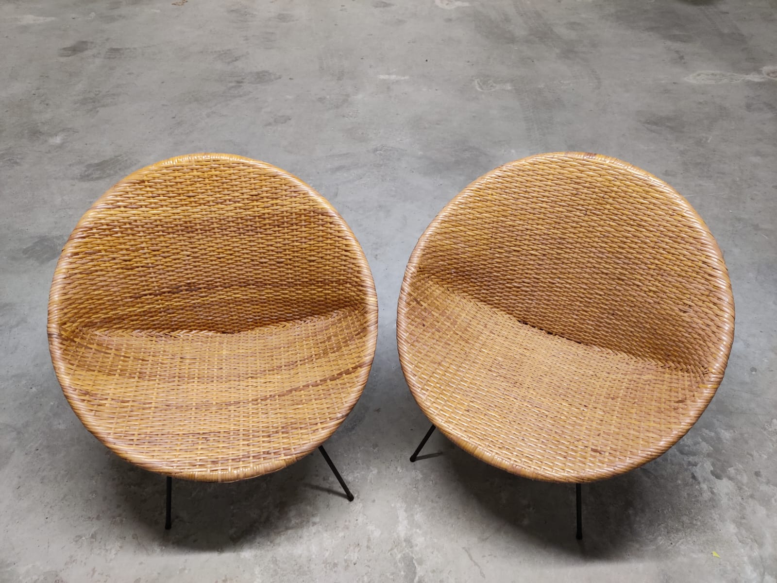 Pair of braided rattan armchairs