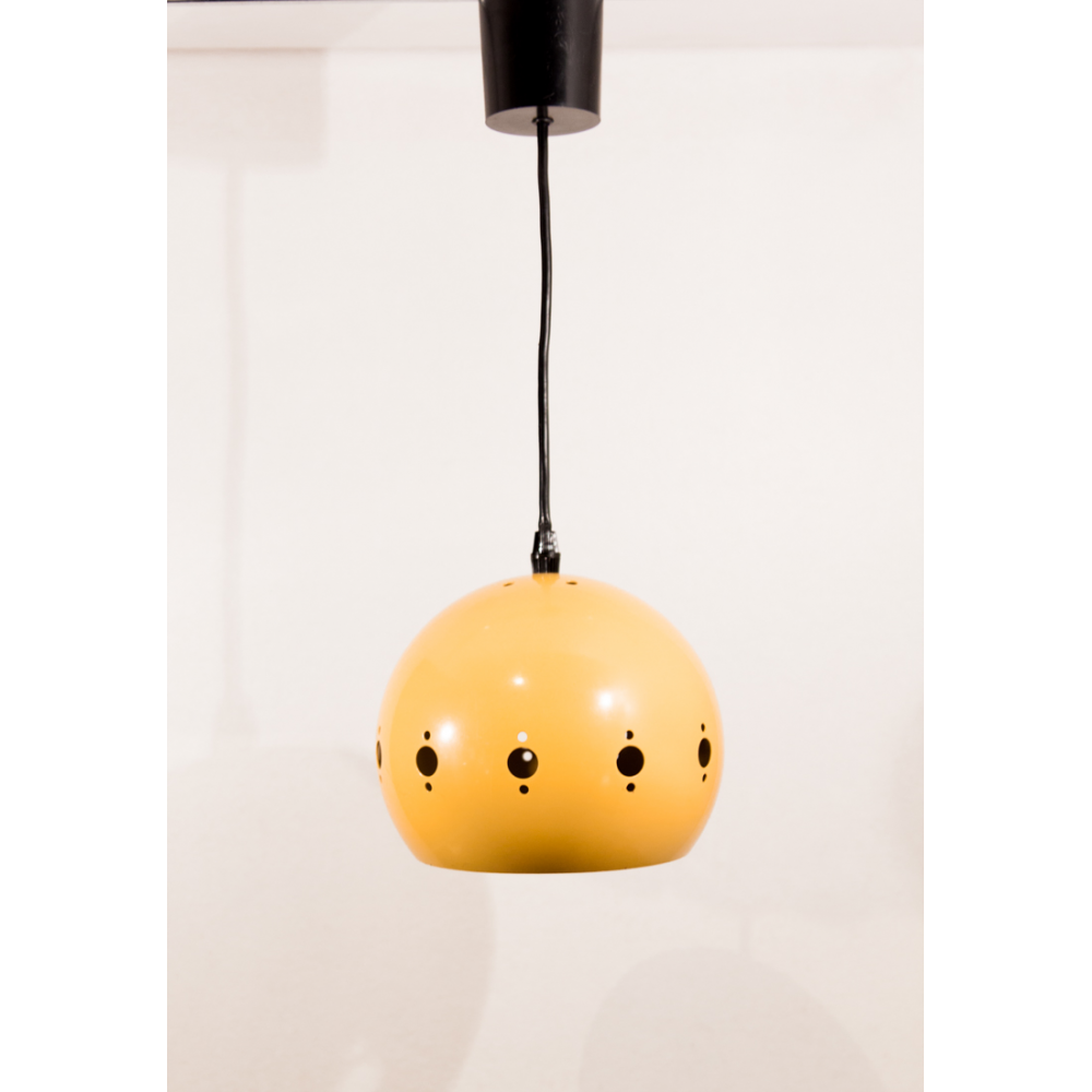 Suspension yellow lacquered metal perforated geometric patterns.