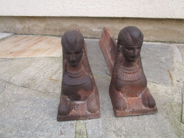 Pair of ancient cast iron chenets, Egyptian busts