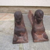 Pair of ancient cast iron chenets, Egyptian busts