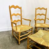 Pair of French Provencal Radassier beech chairs and ottoman, with rush seating.
