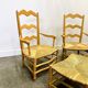 Pair of French Provencal Radassier beech chairs and ottoman, with rush seating.