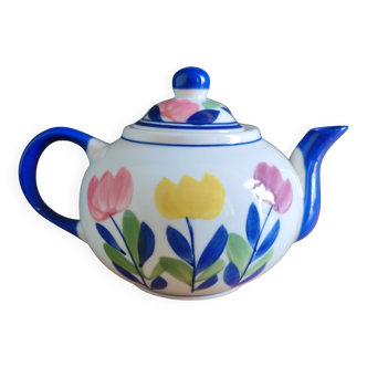 Antique teapot with flower pattern