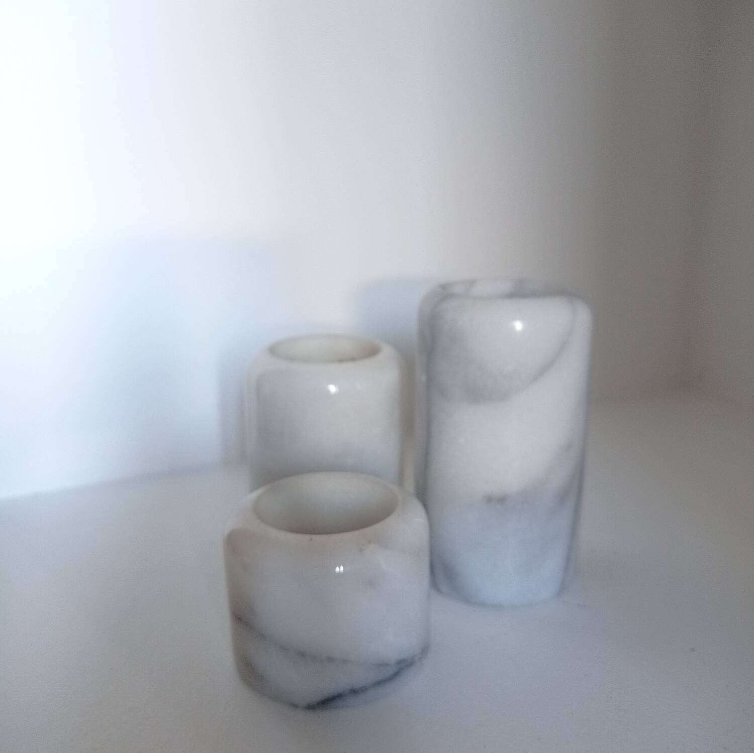 Trio of marble candlesticks