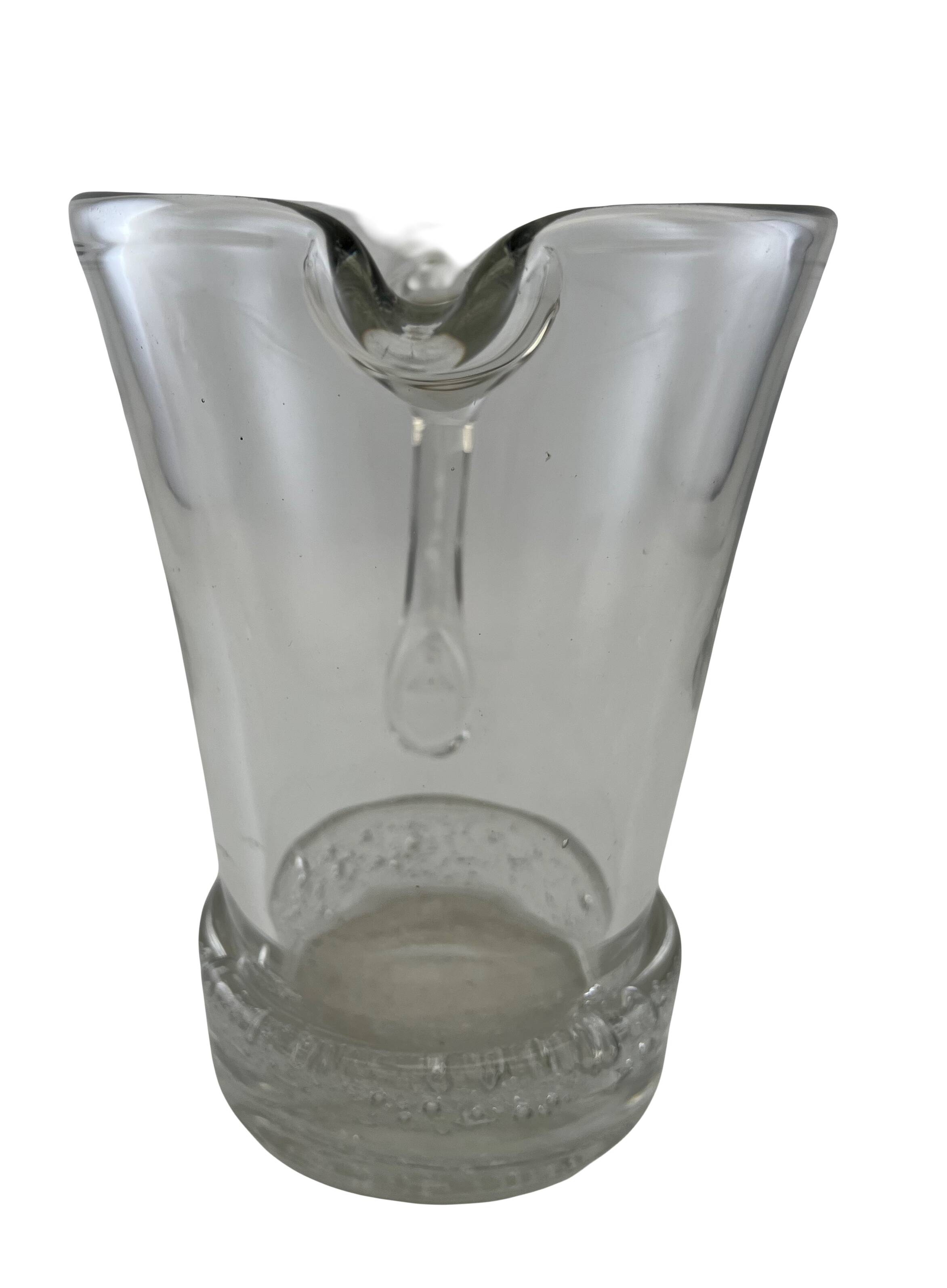 Large stylized glass pitcher