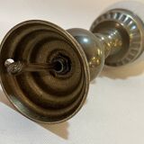 Old bronze or brass table lamp from the early 20th century with white streaked flame glass globe