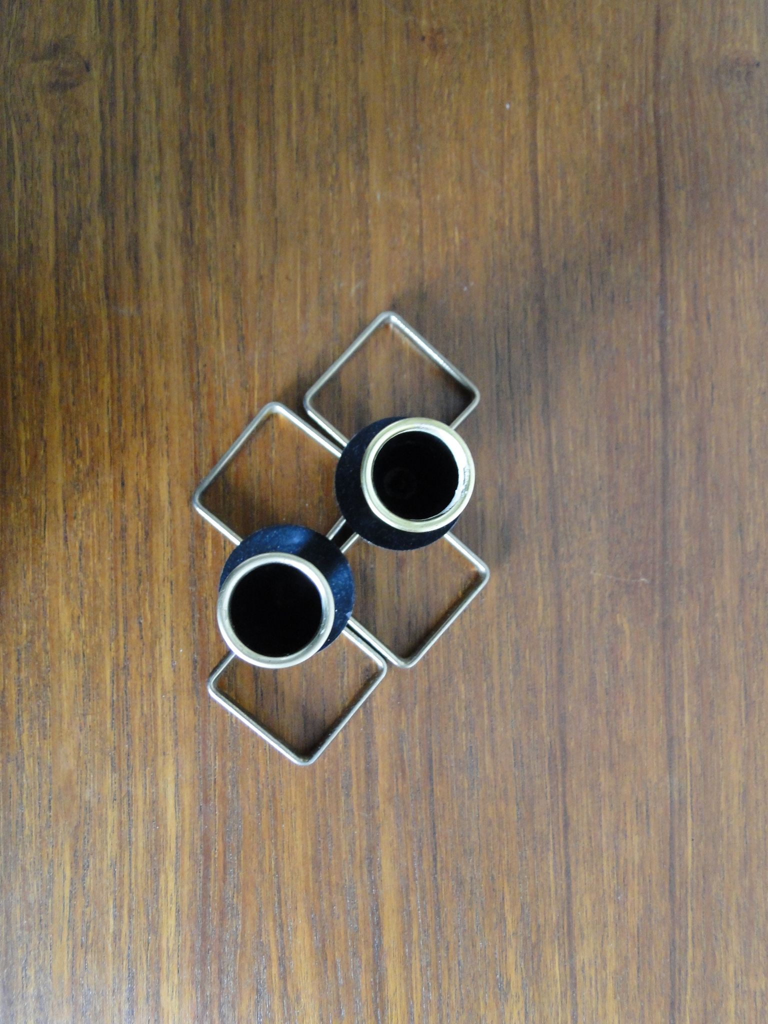 Pair of vintage candle holders in black metal and brass Sweden 1960