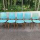 4 Scandinavian dining chairs in solid wood and blue-green leather from the 1950s.