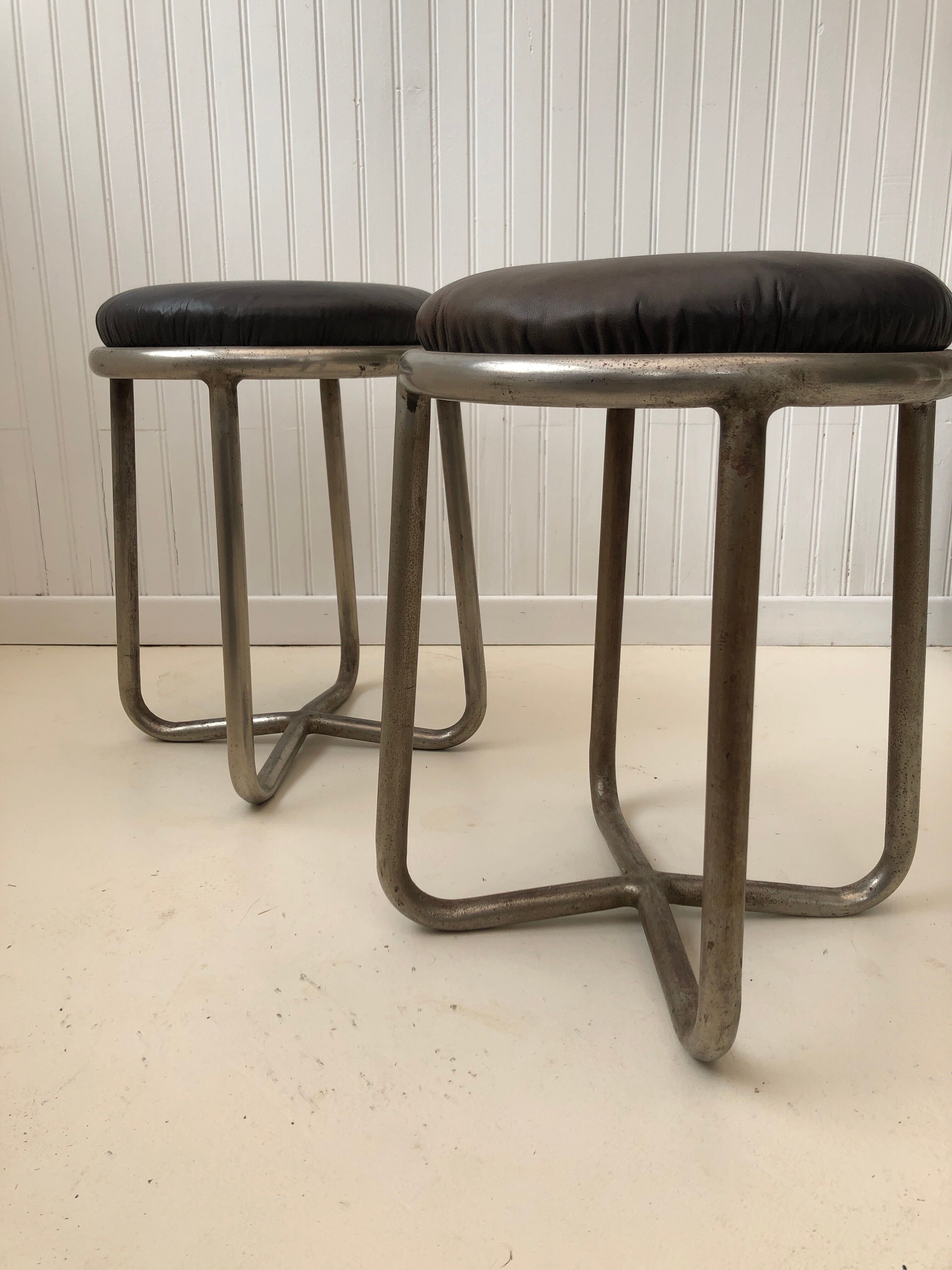 Pair of metal and leather stools