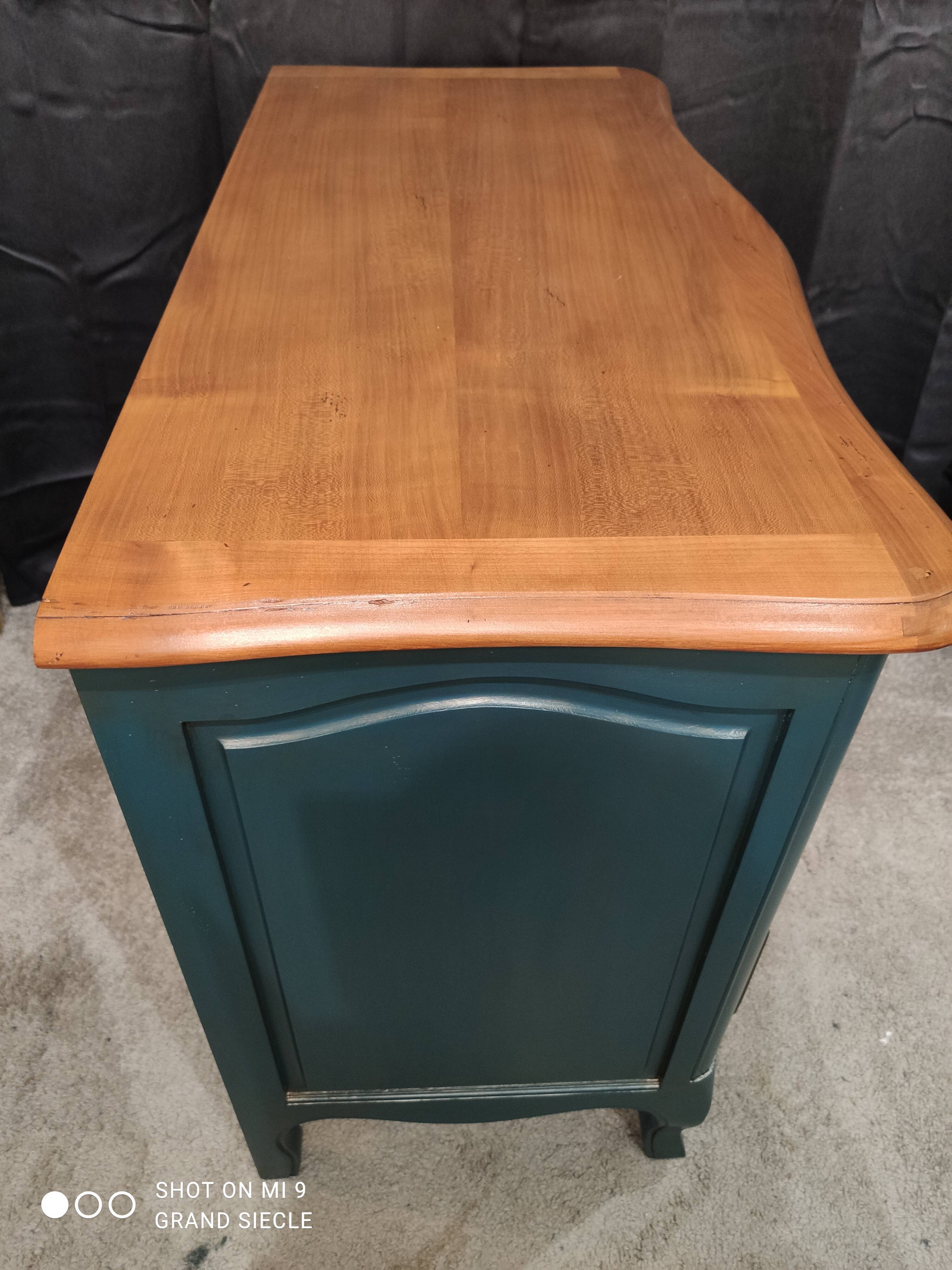 Patinated crossbow chest of drawers