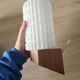 Philips wall sconces in wood and white opal.
