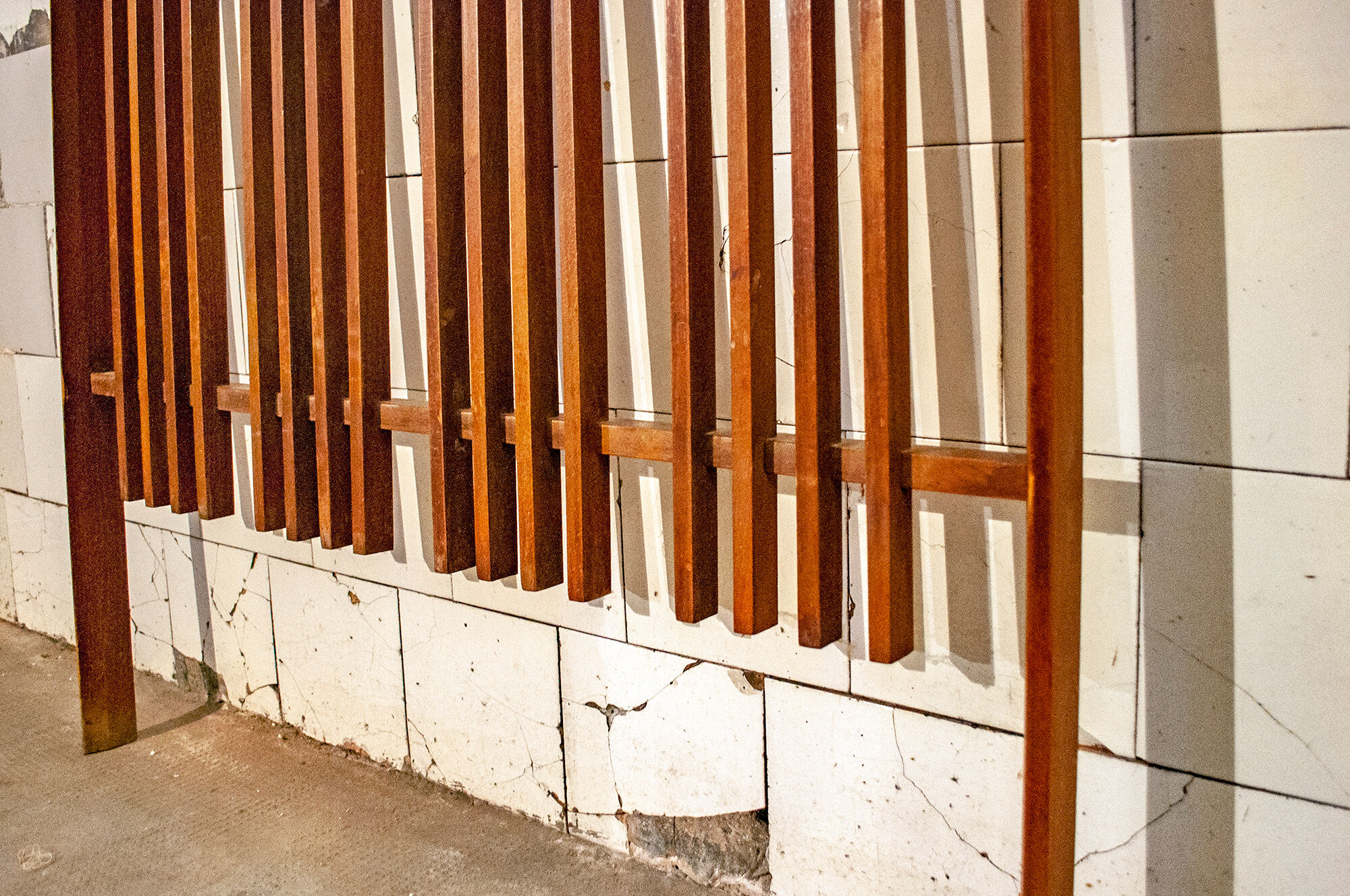 Walnut wood wall coat hangers, with metal details. Italian production 1950s