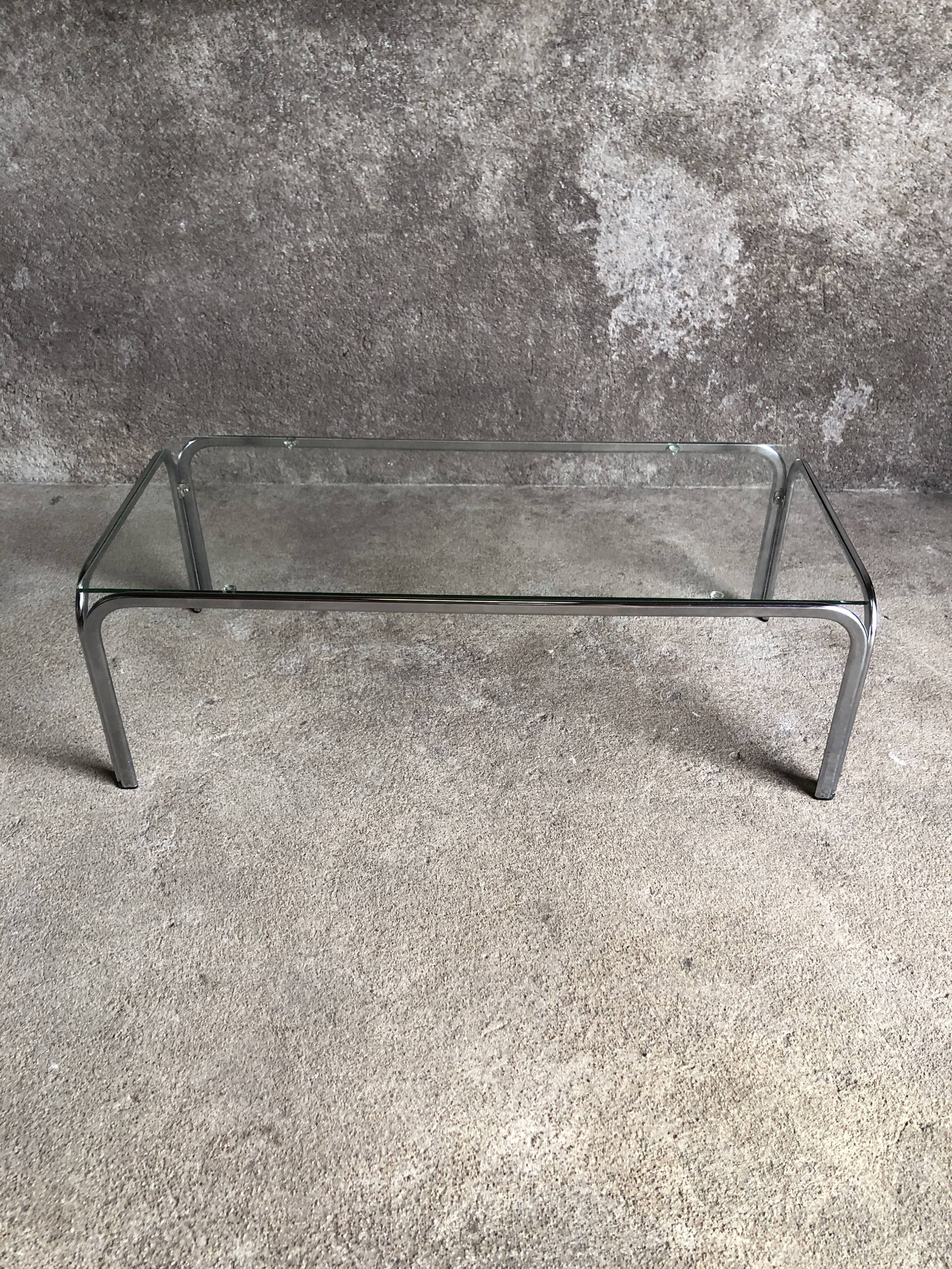 Coffee table with chrome legs and glass top, 1970