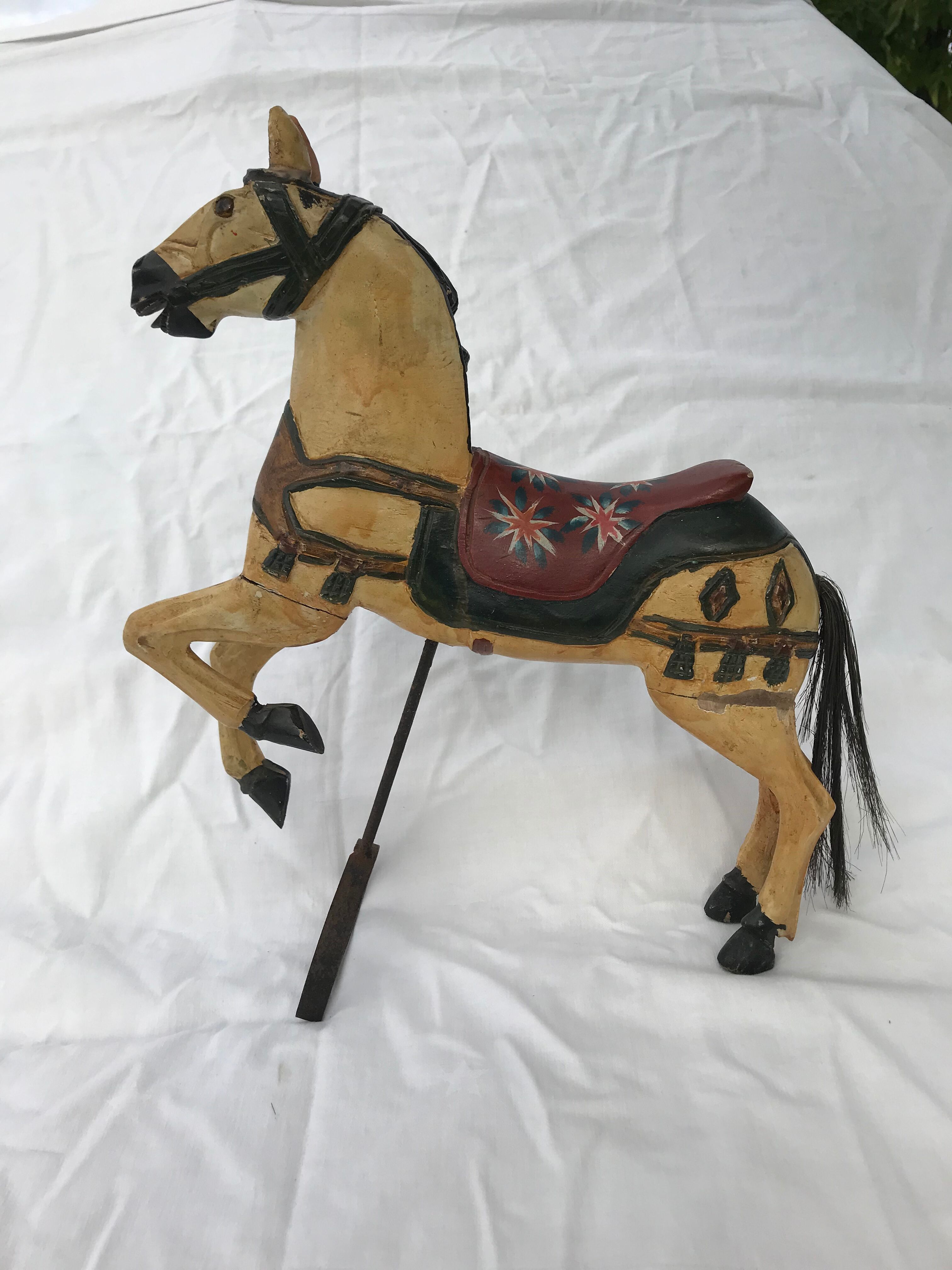 Wooden horse with period ironwork support