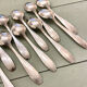 Series of 14 Art Deco dessert spoons, silver metal