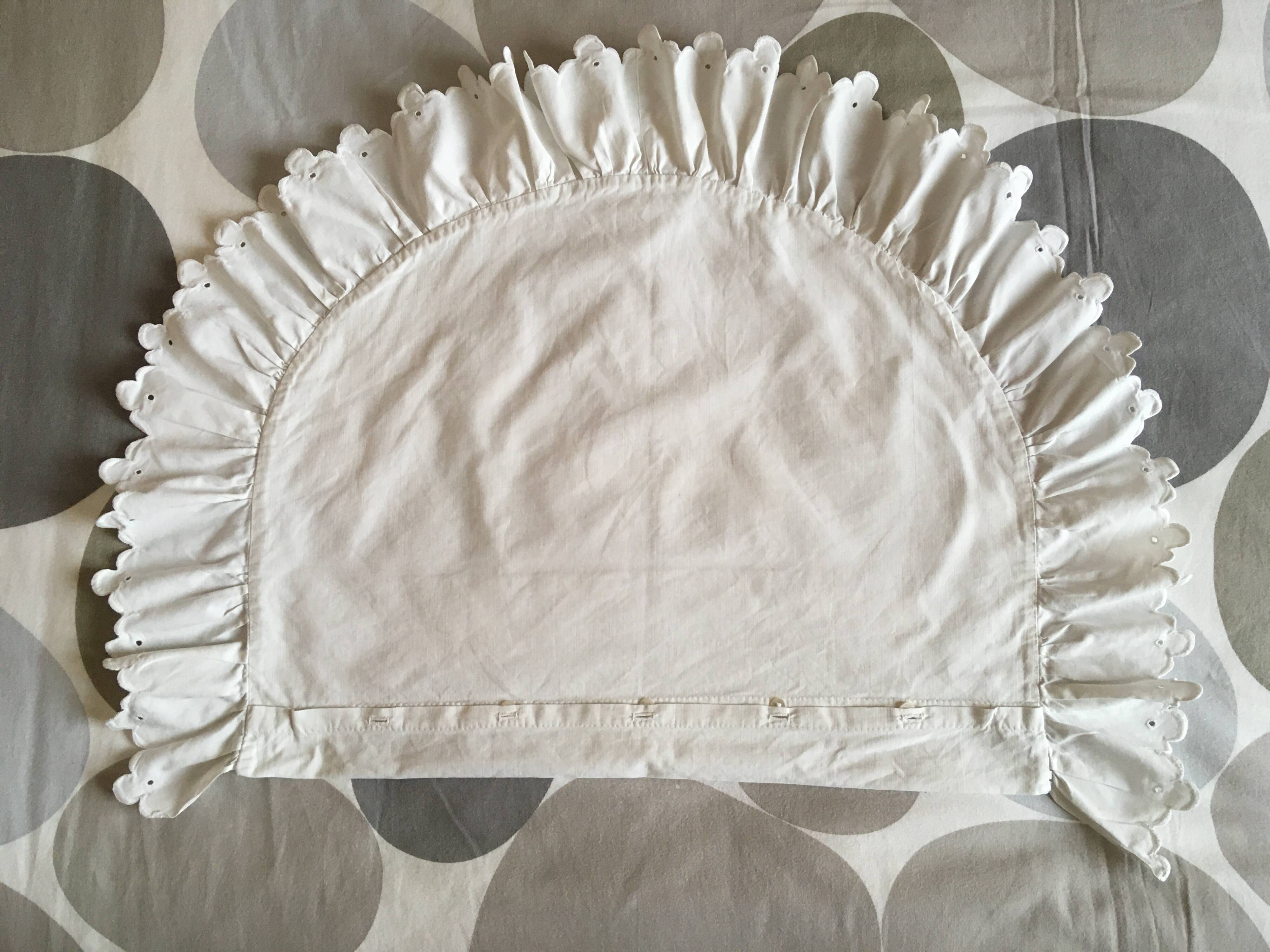 Two half-moon ruffled cushion covers