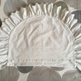 Two half-moon ruffled cushion covers