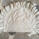 Two half-moon ruffled cushion covers