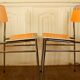 Pair of orange Formica "Tublac" chairs