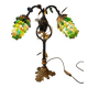 Bronze table lamp and Murano glass grape clusters.
