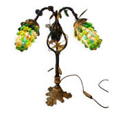 Bronze table lamp and Murano glass grape clusters.
