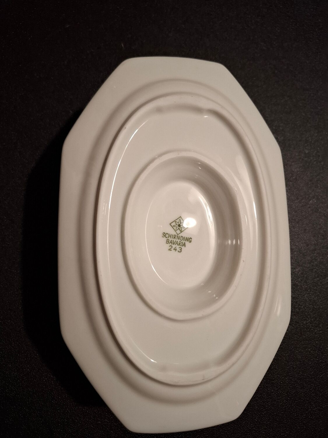 Dishes and porcelain sauceboat