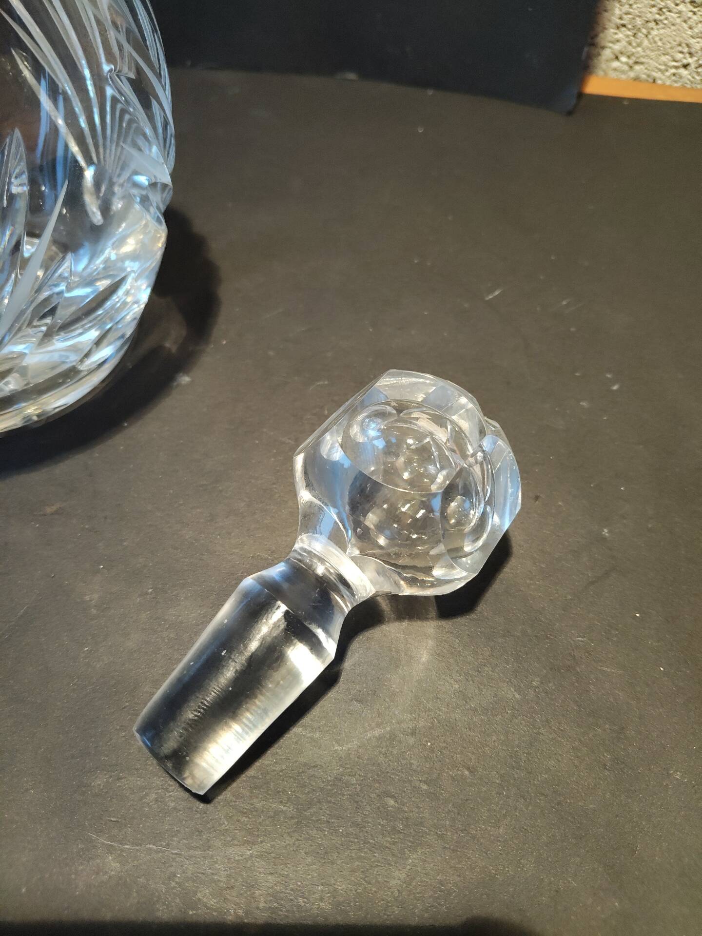 Vintage cut crystal carafe with floral stopper.
