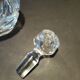 Vintage cut crystal carafe with floral stopper.