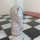 Chess set with ceramic board and pieces.