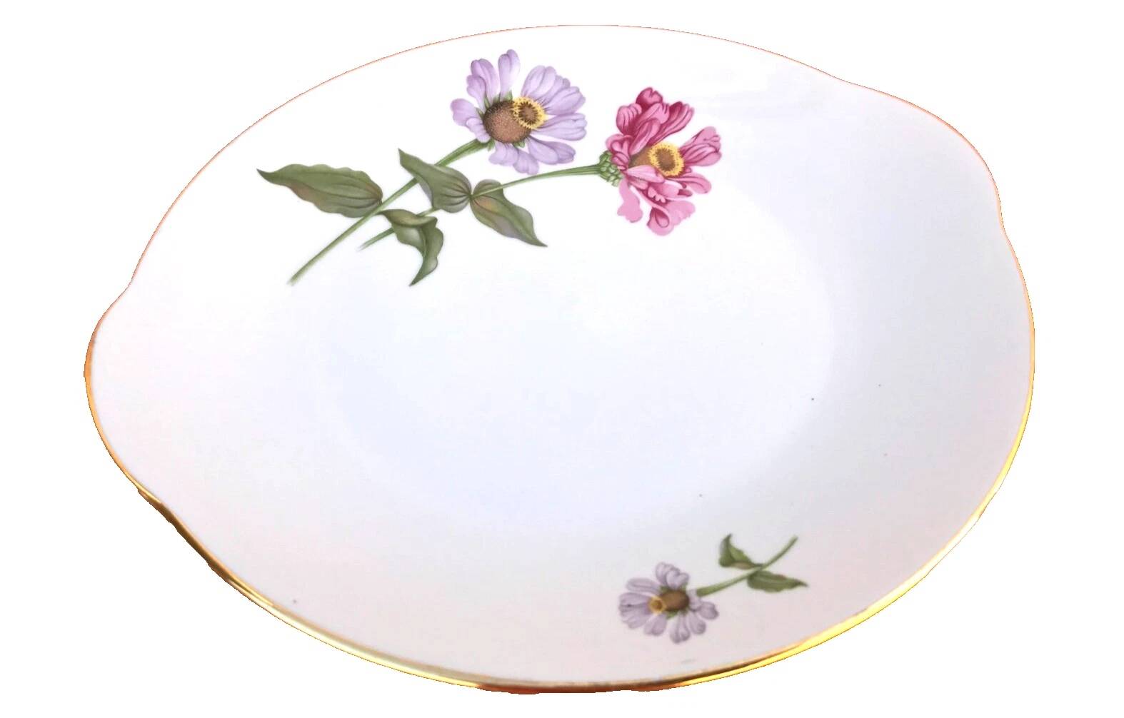 Serving dish with handles, fine Bohemian porcelain with floral decoration on a background.
