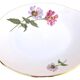 Serving dish with handles, fine Bohemian porcelain with floral decoration on a background.