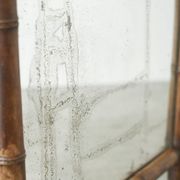 Large faux bamboo mirror in solid wood and patinated mirror, early 20th century.