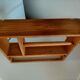 Wooden shelf with unroller wipes everything