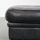 Large and timeless black ottoman made of cowhide leather in English style