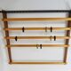 Rare coat rack by Carl Auböck with hat rack, cabinet, brass, walnut and beech, 1950s.