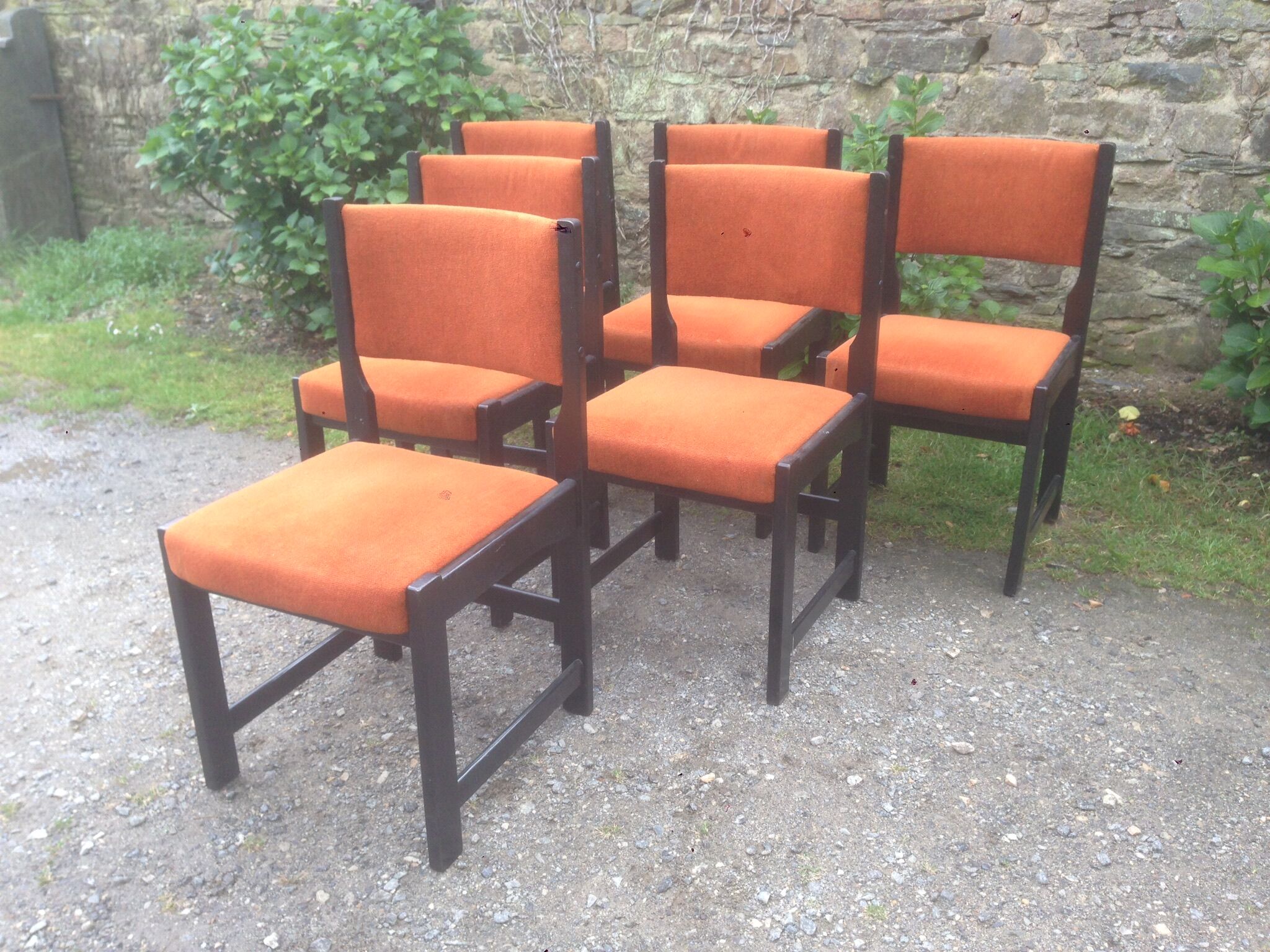 Series of 6 vintage chairs in orange fabric and black lace-up.