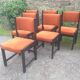 Series of 6 vintage chairs in orange fabric and black lace-up.