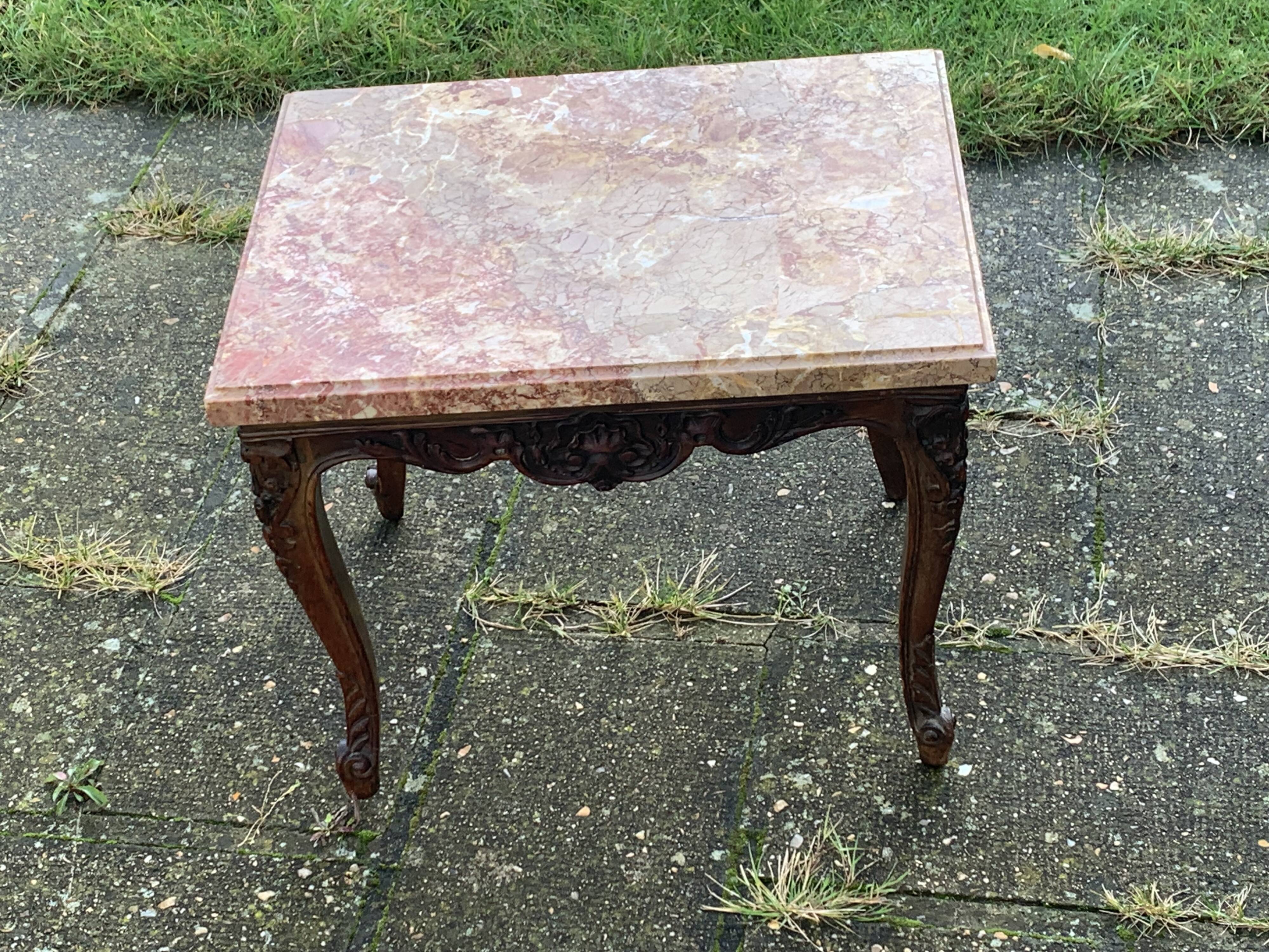 Carved wooden coffee table with shell pattern and removable pink marble top, old