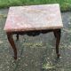 Carved wooden coffee table with shell pattern and removable pink marble top, old