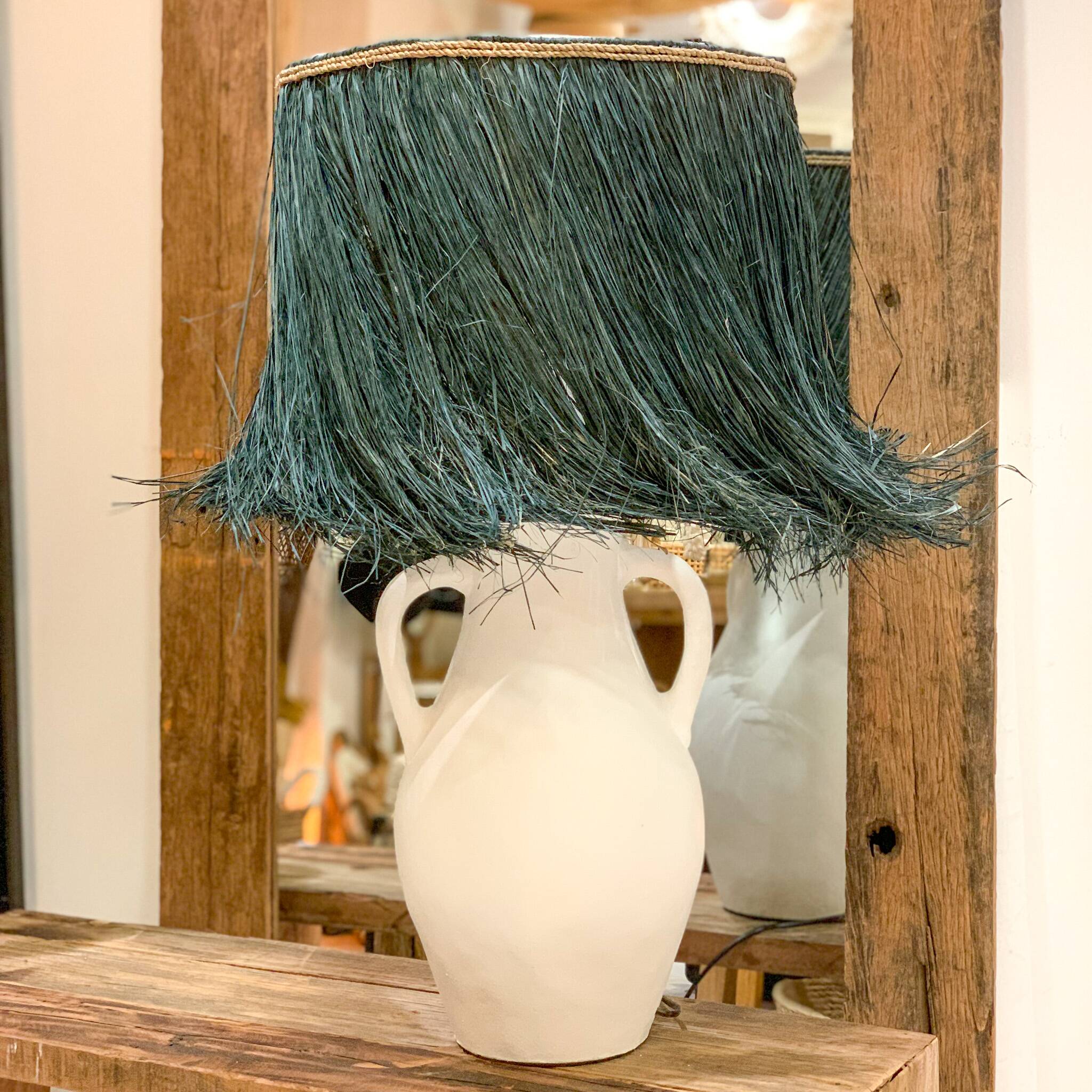 White terracotta lamp and blue raffia lampshade