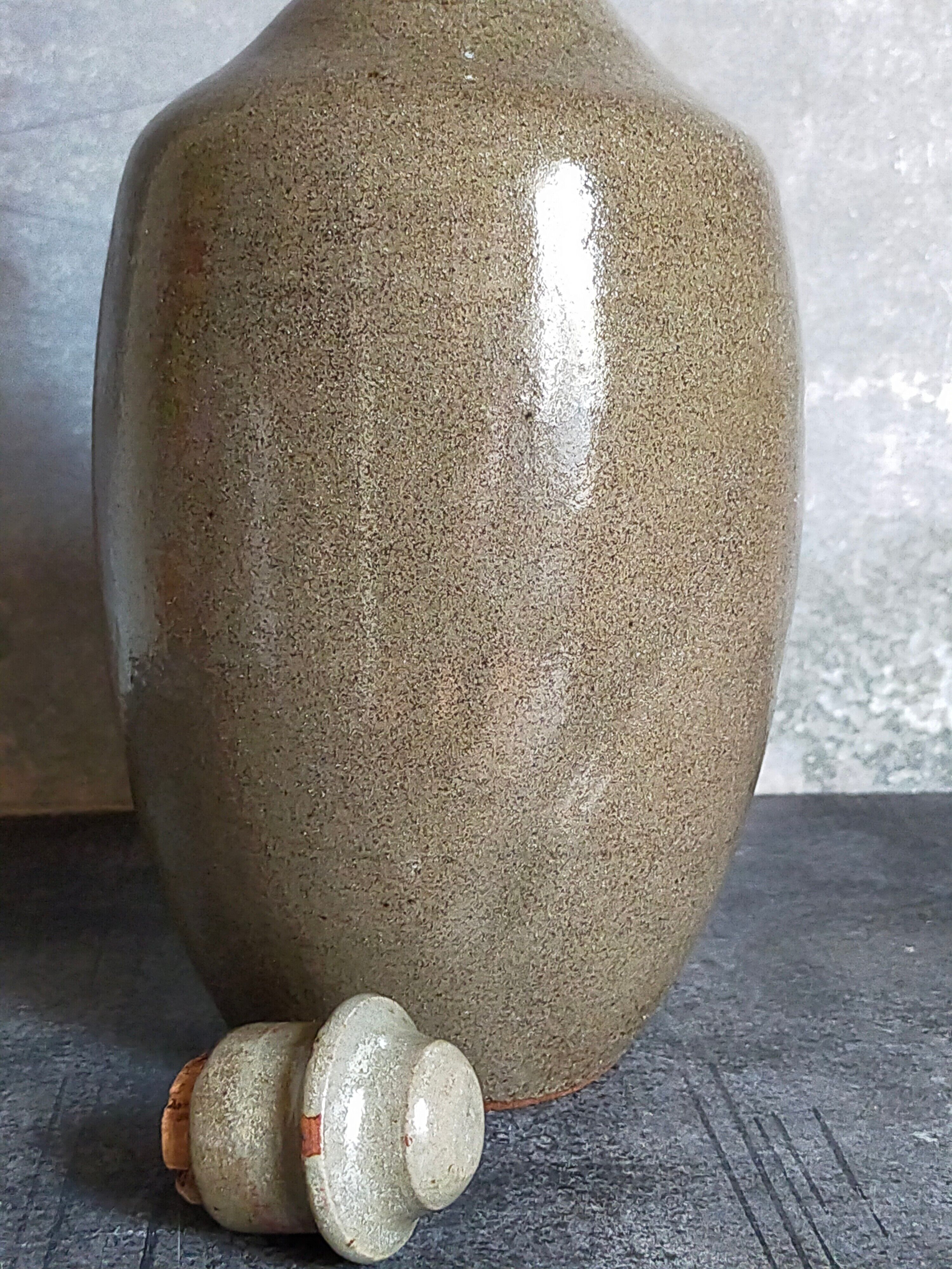 Vintage glazed stoneware potter's liquor bottle