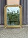 Louis Philippe mirror in gilded wood with an openwork frieze and mercury glass.
