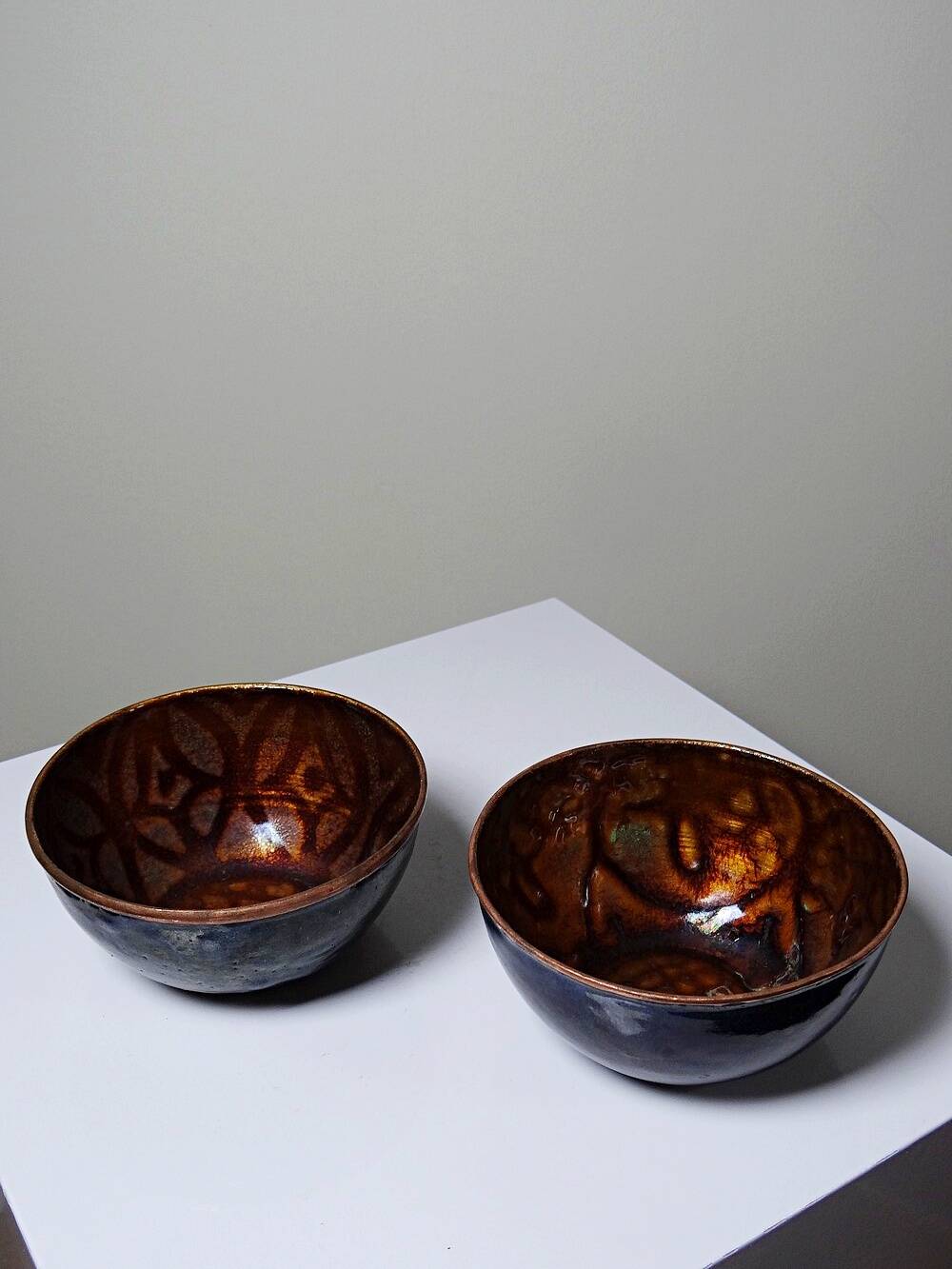 Pair of vintage hand-crafted blue and copper enamelled bowls.