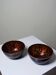Pair of vintage hand-crafted blue and copper enamelled bowls.