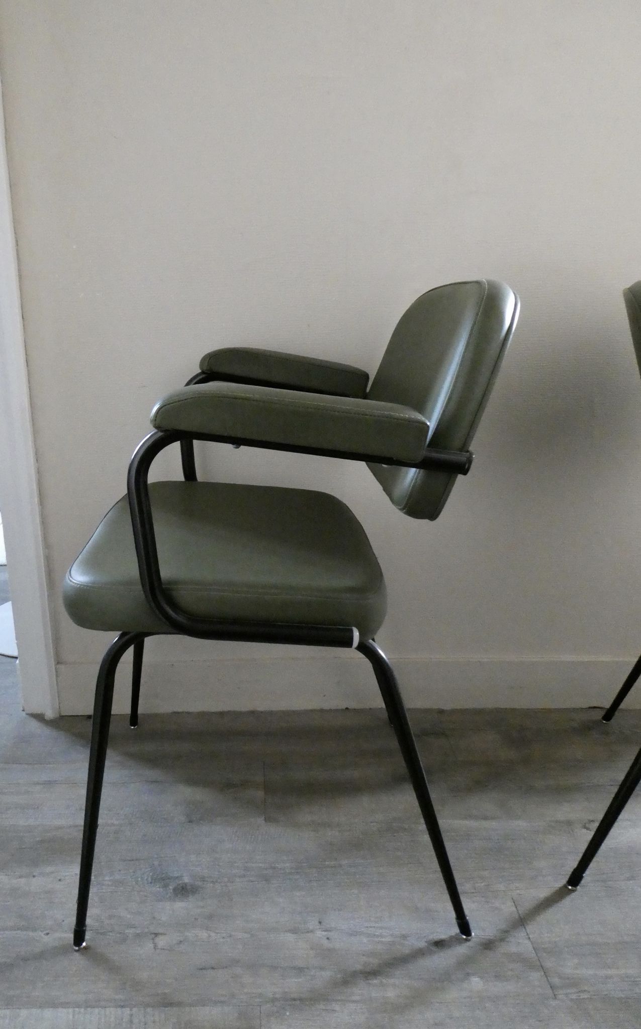 Pair of khaki green metal and skai armchairs from the 1960s