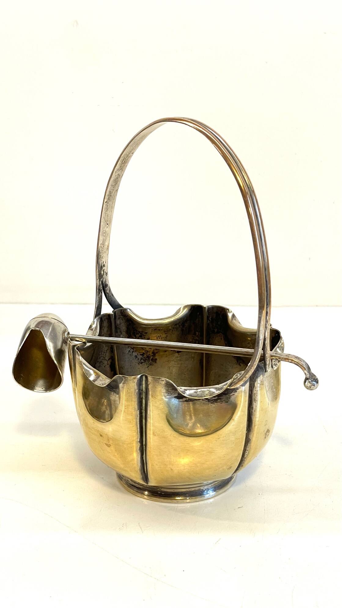 silver metal sugar bowl with gold patina