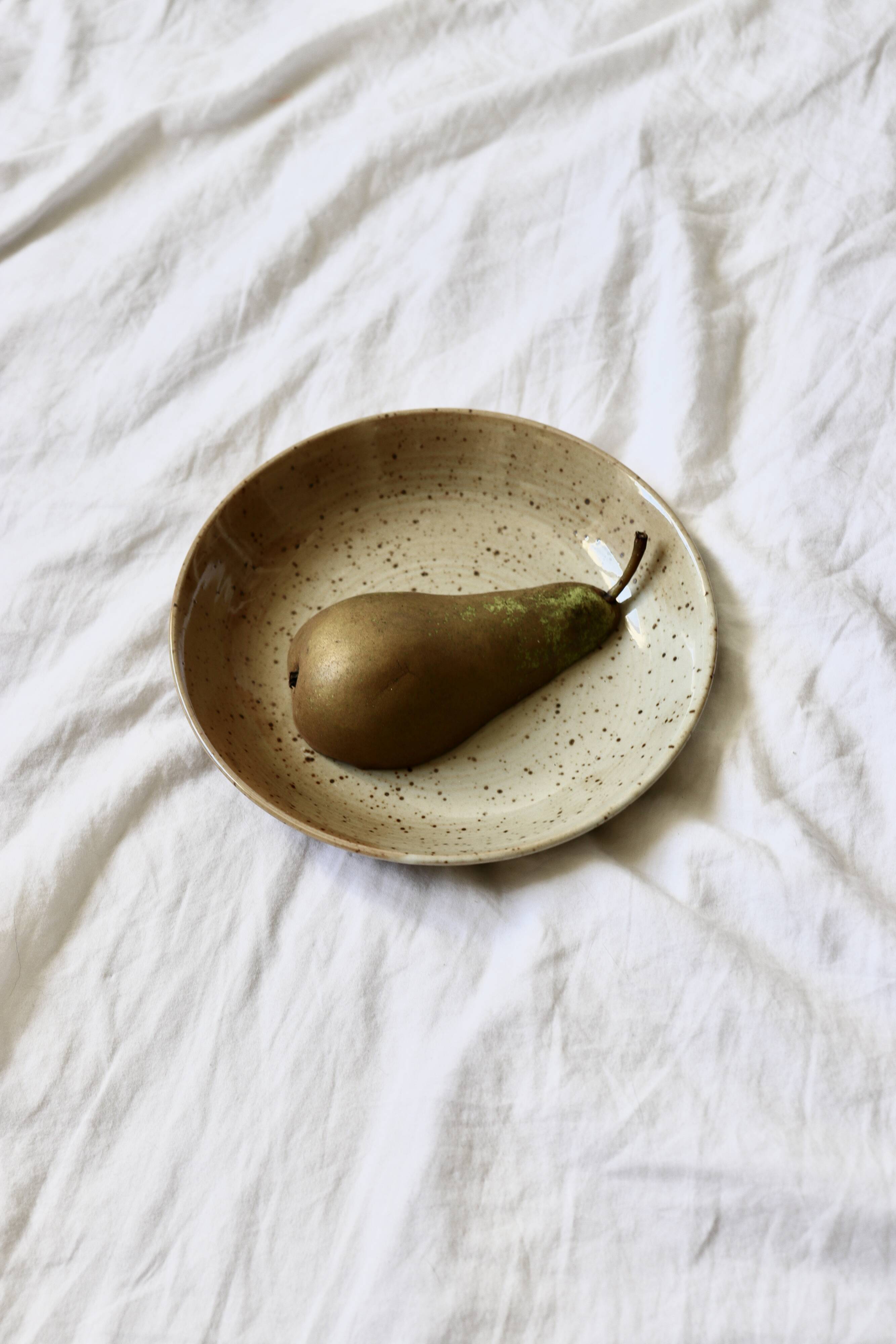 7 speckled stoneware plates