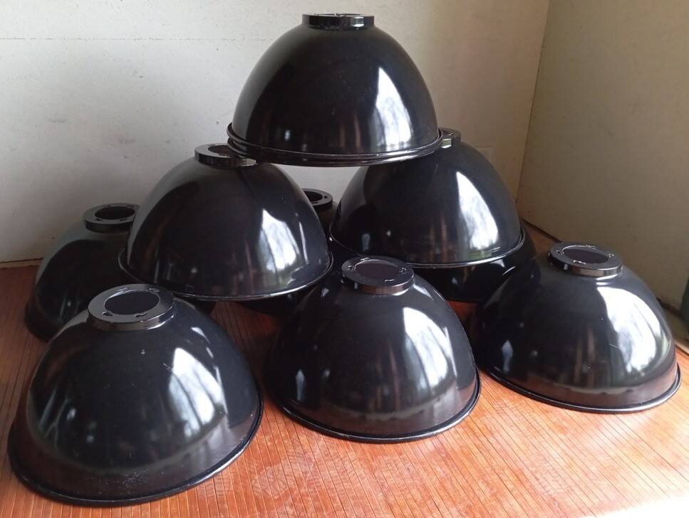 Set of 10 large industrial enamelled metal pendants.