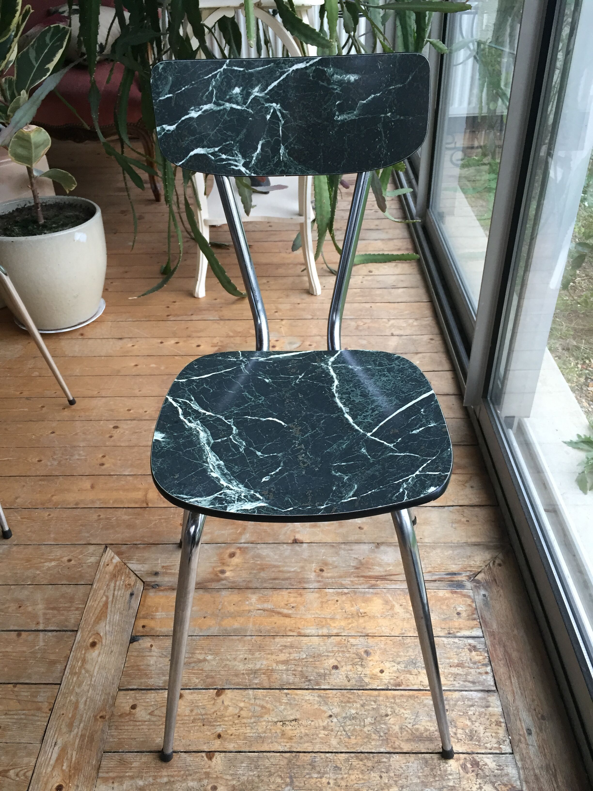 4 chairs in very dark green formica marble effect